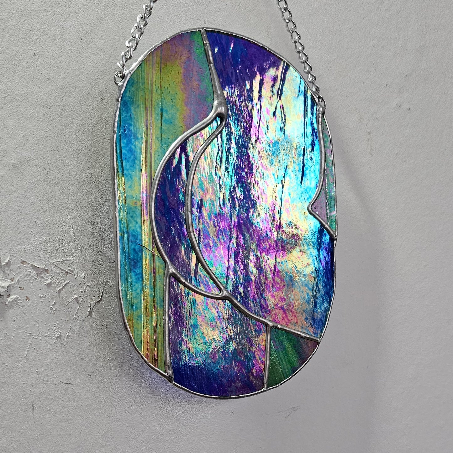 Fesses irisées vert et bleu